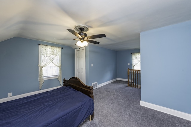 10415 W Ames Ave, Beach Park, IL 60087 - bedroom featuring vaulted ceiling, multiple windows, carpet flooring, and ceiling fan