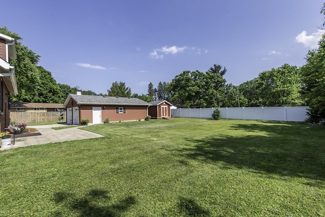 10415 W Ames Ave, Beach Park, IL 60087 - fenced backyard with a storage shed, a garage, and a patio