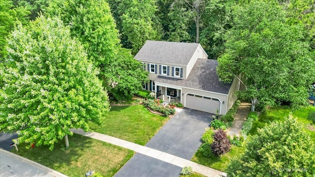 515 Timbers Trl, Saint Charles, IL 60174 - view of front of home featuring driveway, a front lawn, roof with shingles, and an attached garage