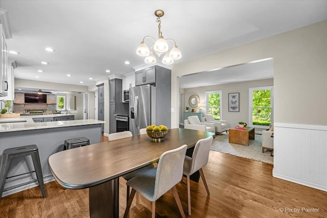 515 Timbers Trl, Saint Charles, IL 60174 - dining room with plenty of natural light, wood finished floors, wainscoting, a chandelier, and recessed lighting