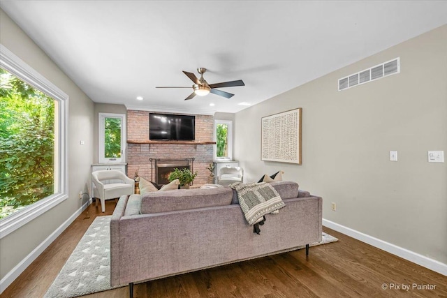 515 Timbers Trl, Saint Charles, IL 60174 - living area featuring a ceiling fan, a fireplace, and dark wood-style flooring