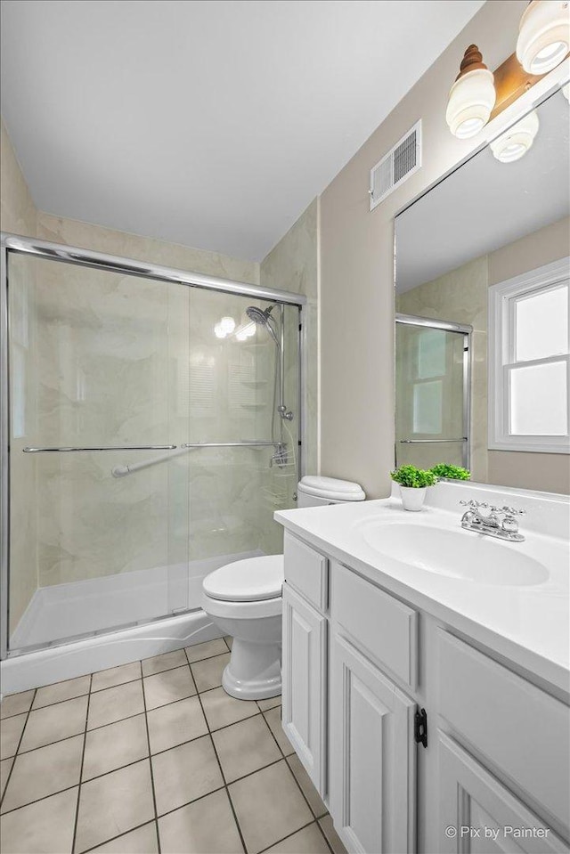 515 Timbers Trl, Saint Charles, IL 60174 - bathroom featuring vanity, tile patterned floors, and a stall shower
