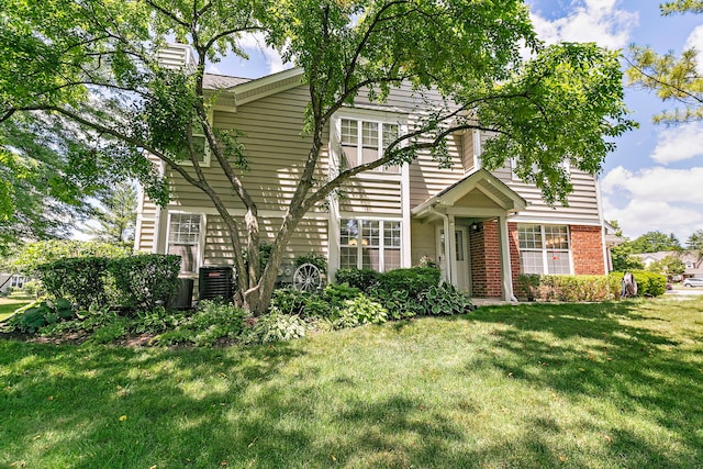 322 Winfield Ct, Schaumburg, IL 60194 - view of front of property with a front lawn, a chimney, and brick siding