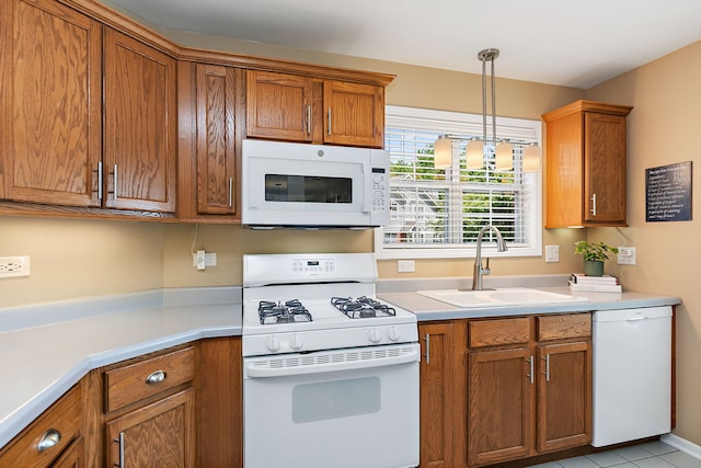 322 Winfield Ct, Schaumburg, IL 60194 - kitchen with white appliances, brown cabinets, light countertops, and pendant lighting