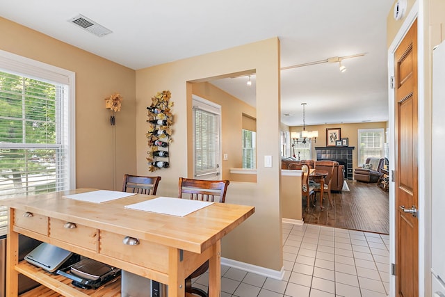 322 Winfield Ct, Schaumburg, IL 60194 - dining room with a chandelier, light tile patterned floors, and healthy amount of natural light