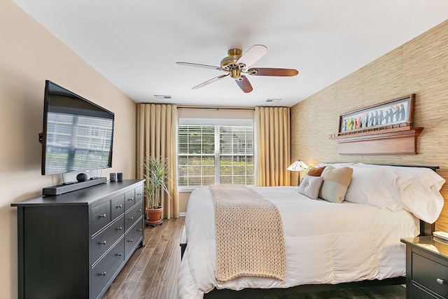 322 Winfield Ct, Schaumburg, IL 60194 - bedroom with wood finished floors, a ceiling fan, and an accent wall