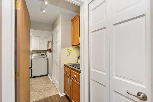 322 Winfield Ct, Schaumburg, IL 60194 - washroom featuring washer / clothes dryer, cabinet space, dark wood-type flooring, and track lighting