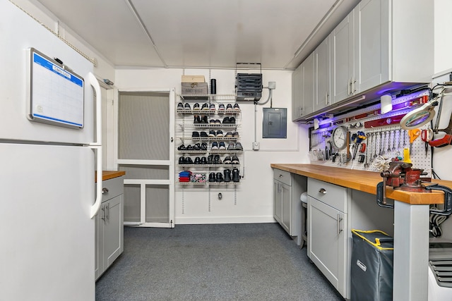 322 Winfield Ct, Schaumburg, IL 60194 - kitchen featuring freestanding refrigerator, butcher block counters, electric panel, gray cabinets, and dark carpet