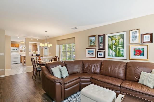 322 Winfield Ct, Schaumburg, IL 60194 - living room with a chandelier, wood-type flooring, and rail lighting