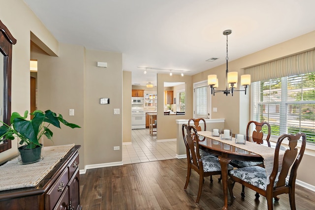 322 Winfield Ct, Schaumburg, IL 60194 - dining space featuring a chandelier and dark wood finished floors