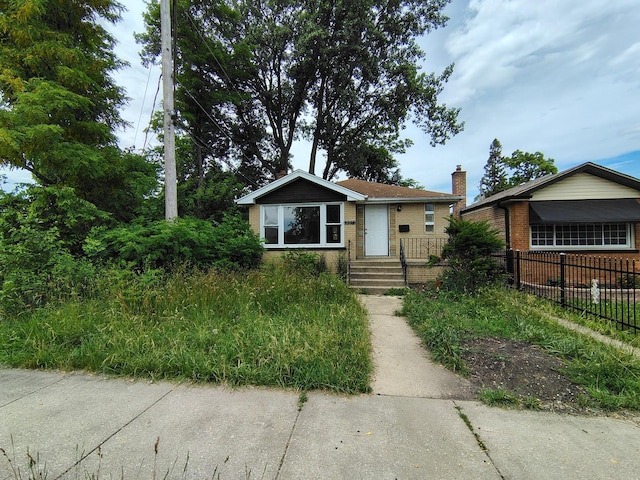 8924 S Paulina St, Chicago, IL 60620 - bungalow-style home featuring a chimney and brick siding