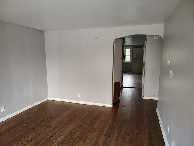 8924 S Paulina St, Chicago, IL 60620 - unfurnished room featuring arched walkways and wood finished floors