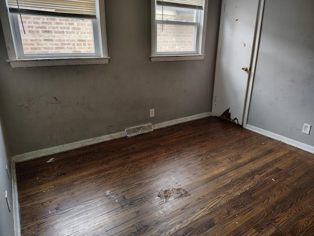 8924 S Paulina St, Chicago, IL 60620 - unfurnished room with plenty of natural light and dark wood-style flooring