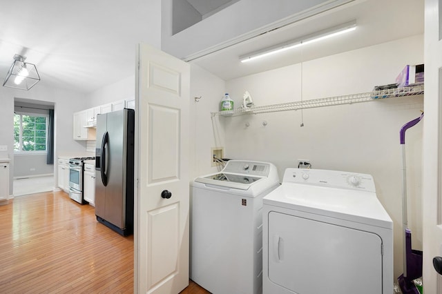 7358 Grandview Ct Unit 7358, Carpentersville, IL 60110 - laundry room with independent washer and dryer and light wood-type flooring