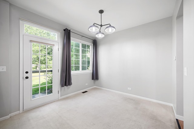 7358 Grandview Ct Unit 7358, Carpentersville, IL 60110 - unfurnished room with a chandelier and carpet floors