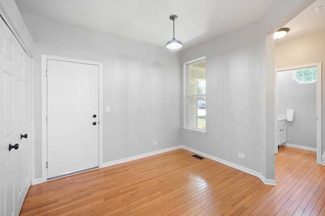 7358 Grandview Ct Unit 7358, Carpentersville, IL 60110 - unfurnished dining area with light wood-style flooring and plenty of natural light