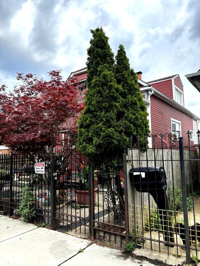 5409 S Richmond St, Chicago, IL 60632 - view of front of property featuring a chimney and a gate