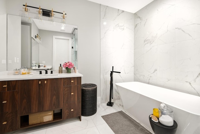 2441 N Clybourn Ave Unit 1, Chicago, IL 60614 - full bath featuring marble tiled flooring, vanity, a soaking tub, and tile walls