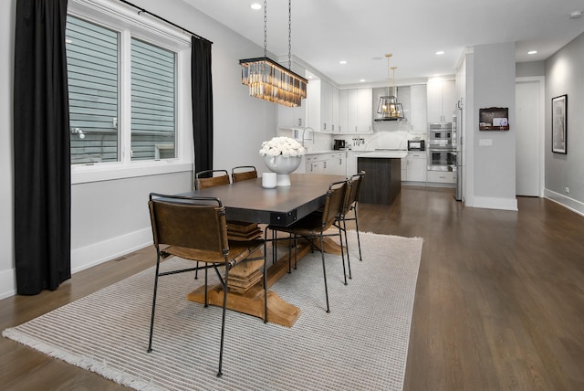 2441 N Clybourn Ave Unit 1, Chicago, IL 60614 - dining area featuring dark wood-type flooring, a chandelier, and recessed lighting