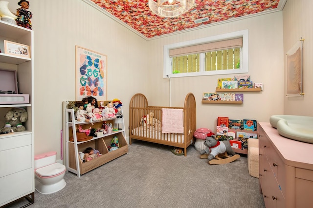 2441 N Clybourn Ave Unit 1, Chicago, IL 60614 - bedroom featuring a nursery area, crown molding, and carpet
