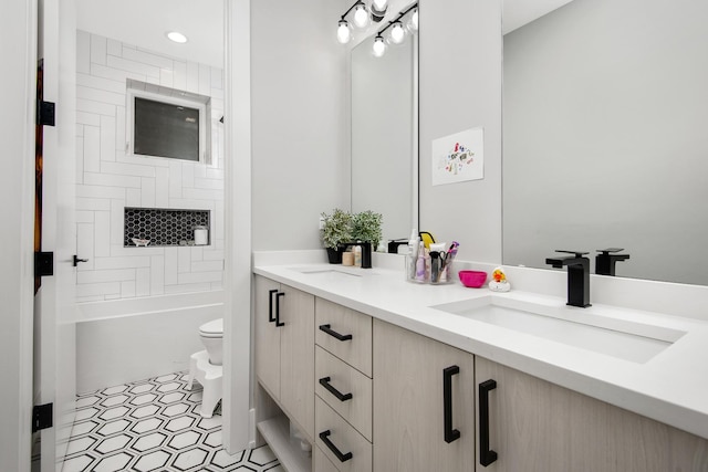 2441 N Clybourn Ave Unit 1, Chicago, IL 60614 - bathroom featuring double vanity, washtub / shower combination, and recessed lighting