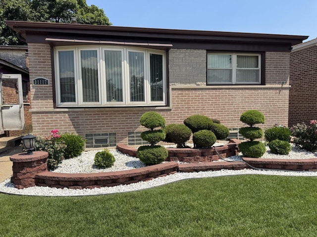 11117 S S Ave L, Chicago, IL 60617 - view of property exterior with a lawn and brick siding
