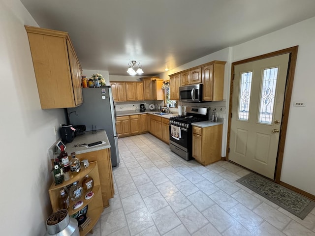 11117 S S Ave L, Chicago, IL 60617 - kitchen featuring stainless steel appliances, plenty of natural light, and light countertops