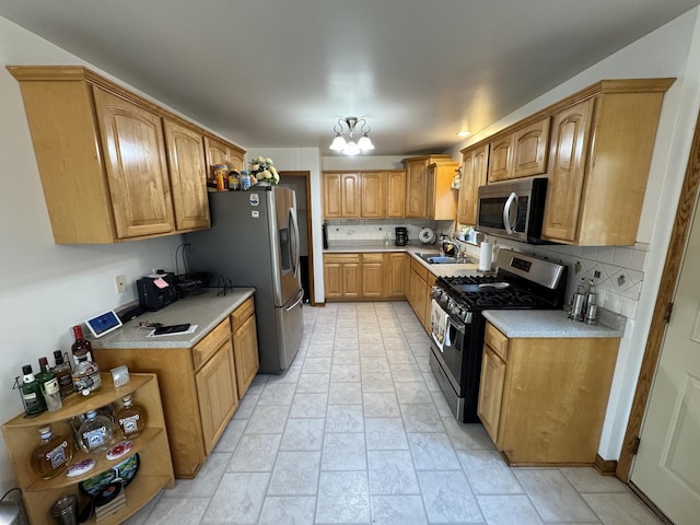 11117 S S Ave L, Chicago, IL 60617 - kitchen with stainless steel appliances, backsplash, light countertops, light stone finish floors, and brown cabinetry
