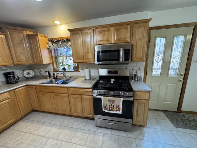 11117 S S Ave L, Chicago, IL 60617 - kitchen featuring stainless steel appliances, light countertops, and backsplash