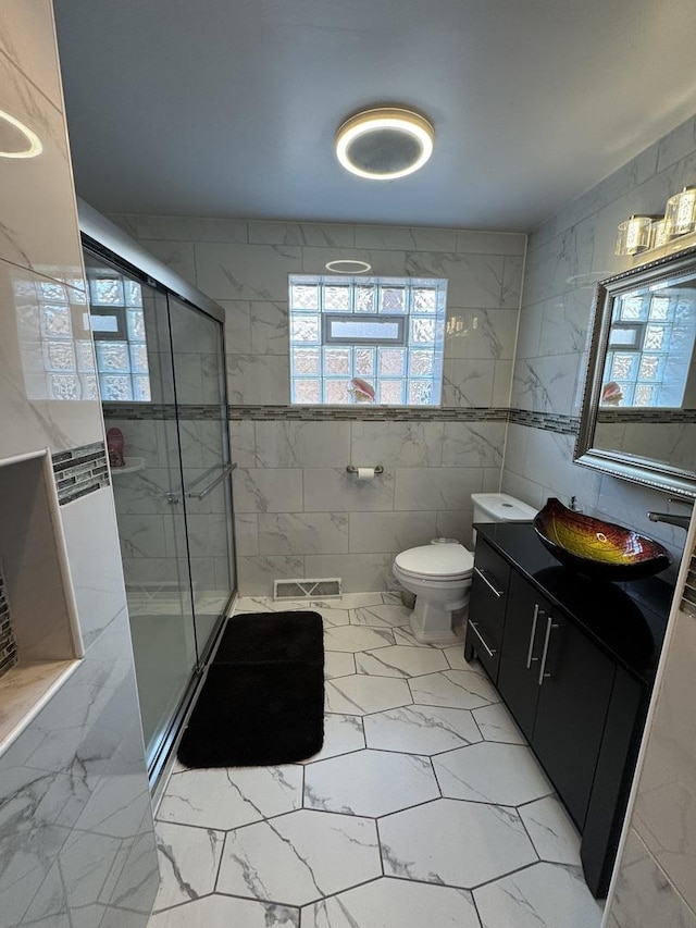 11117 S S Ave L, Chicago, IL 60617 - full bathroom featuring marble finish flooring, a stall shower, vanity, and tile walls