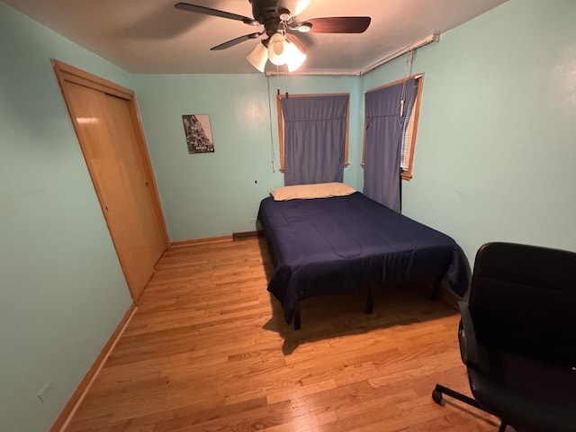 11117 S S Ave L, Chicago, IL 60617 - bedroom featuring light wood-style floors, ceiling fan, and a closet