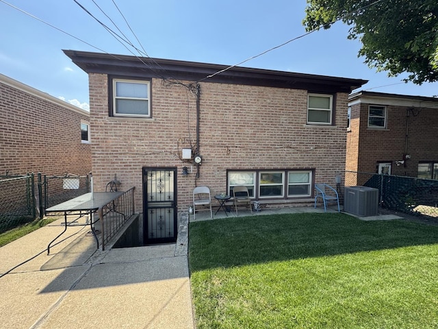 11117 S S Ave L, Chicago, IL 60617 - back of property with a patio area, a fenced backyard, brick siding, and a gate