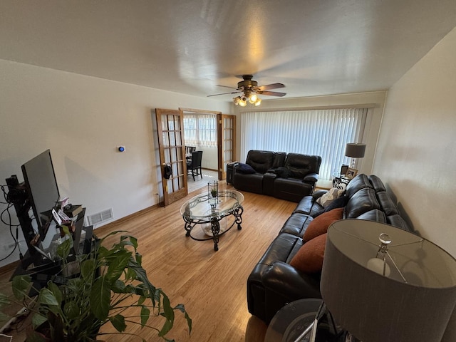 11117 S S Ave L, Chicago, IL 60617 - living room featuring light wood-style flooring and ceiling fan