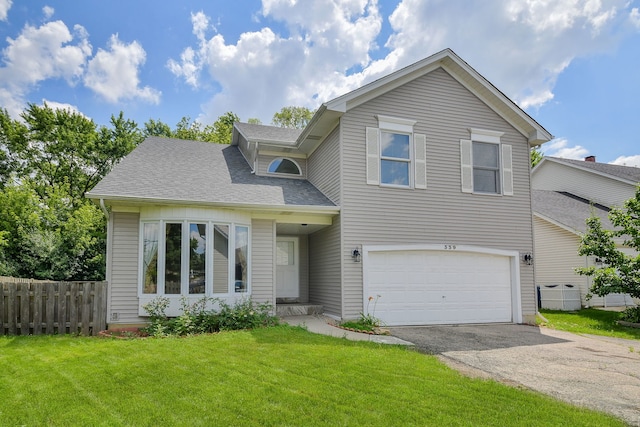 339 Windsor Dr, Bartlett, IL 60103 - traditional-style home featuring driveway, a garage, and roof with shingles