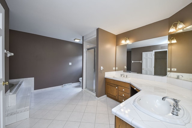 339 Windsor Dr, Bartlett, IL 60103 - full bath with double vanity, a shower stall, tile patterned flooring, and a bathtub