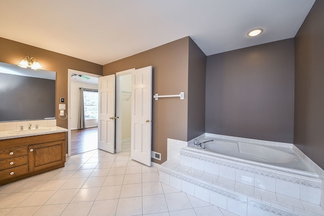 339 Windsor Dr, Bartlett, IL 60103 - bathroom with a bath, vanity, and tile patterned floors