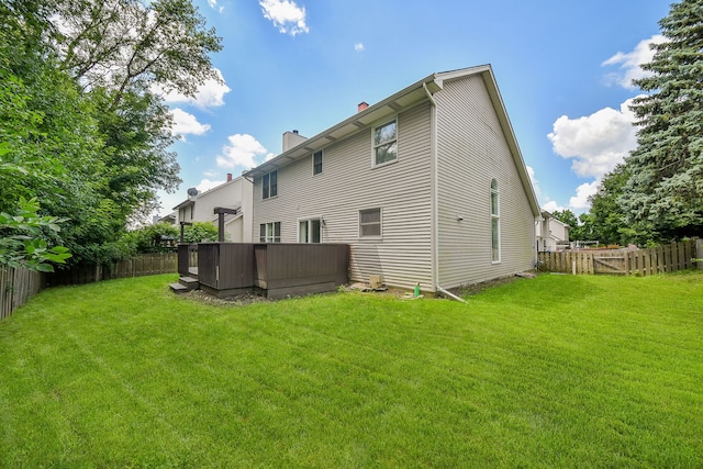 339 Windsor Dr, Bartlett, IL 60103 - back of house with a chimney and a fenced backyard
