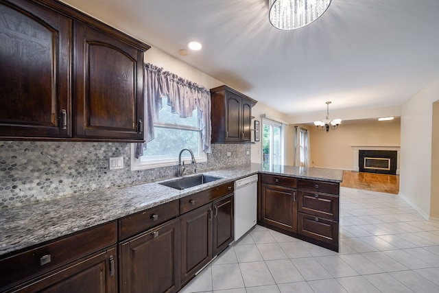 339 Windsor Dr, Bartlett, IL 60103 - kitchen with dishwasher, tasteful backsplash, a chandelier, light tile patterned floors, and light stone countertops