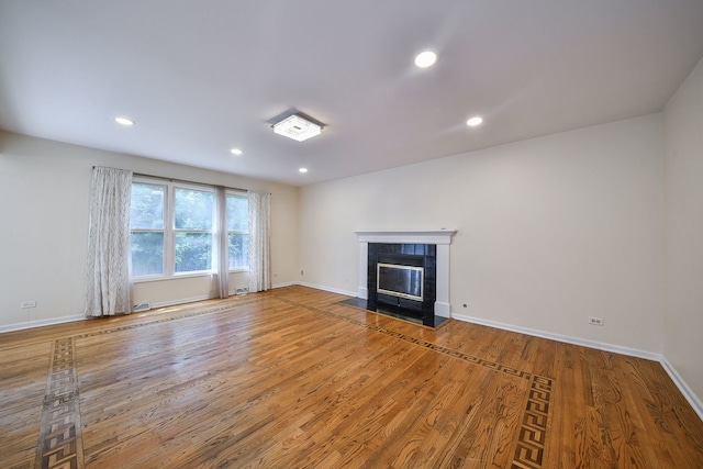 339 Windsor Dr, Bartlett, IL 60103 - unfurnished living room featuring wood finished floors, a fireplace, and recessed lighting
