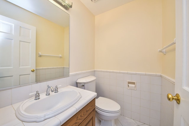 339 Windsor Dr, Bartlett, IL 60103 - half bath with tile walls, a wainscoted wall, and vanity