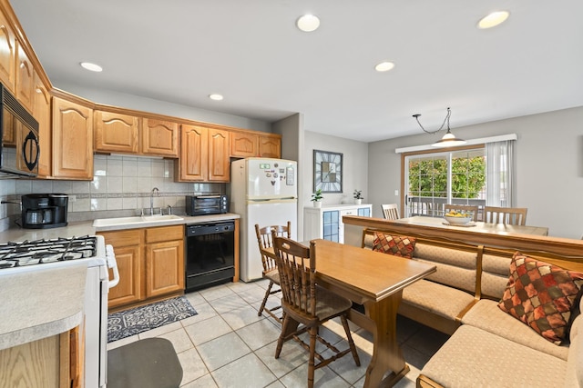 18211 Eagle Dr, Tinley Park, IL 60477 - kitchen with black appliances, light countertops, decorative backsplash, recessed lighting, and light tile patterned flooring