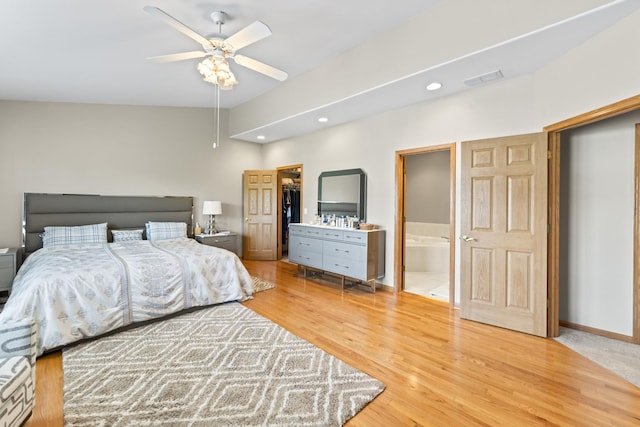 18211 Eagle Dr, Tinley Park, IL 60477 - bedroom featuring recessed lighting, light wood finished floors, ensuite bathroom, a walk in closet, and a ceiling fan