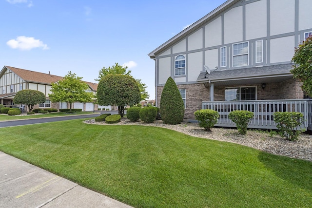 18211 Eagle Dr, Tinley Park, IL 60477 - view of side of home featuring brick siding, a lawn, and stucco siding