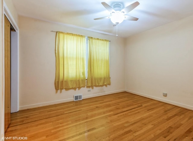 5547 N California Ave, Chicago, IL 60625 - unfurnished room with light wood-style flooring and ceiling fan