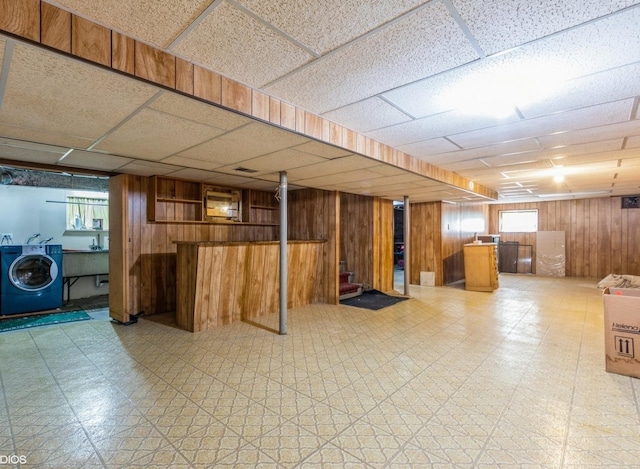 5547 N California Ave, Chicago, IL 60625 - below grade area featuring washer / dryer, light floors, wooden walls, plenty of natural light, and stairway