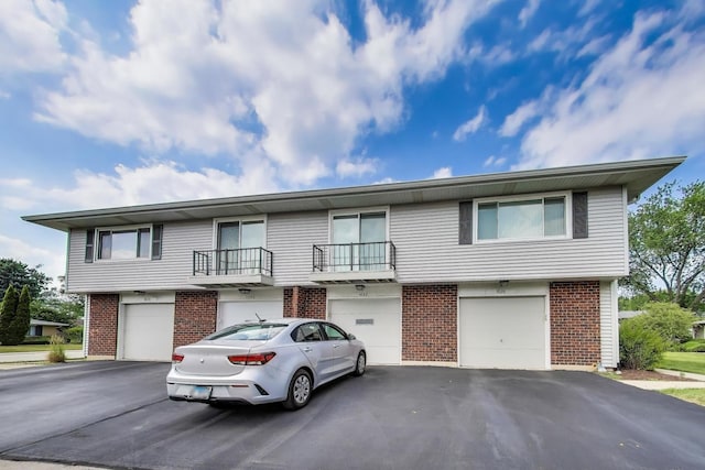 1042 Quanset Ct, Schaumburg, IL 60194 - view of front of property featuring brick siding, driveway, and a garage