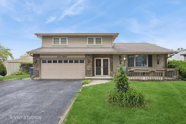 715 N Lawler Ave, Addison, IL 60101 - view of front of property with a garage, a front lawn, driveway, and a porch