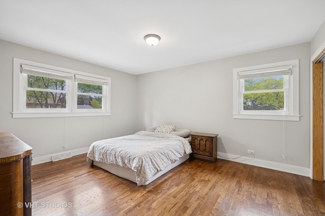 715 N Lawler Ave, Addison, IL 60101 - bedroom featuring baseboards and wood finished floors