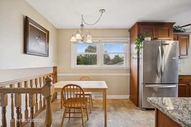 715 N Lawler Ave, Addison, IL 60101 - dining room with a chandelier and stone finish floors