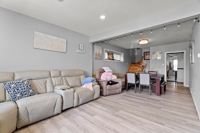 11030 S Ave L, Chicago, IL 60617 - living room with stairway, light wood finished floors, and recessed lighting